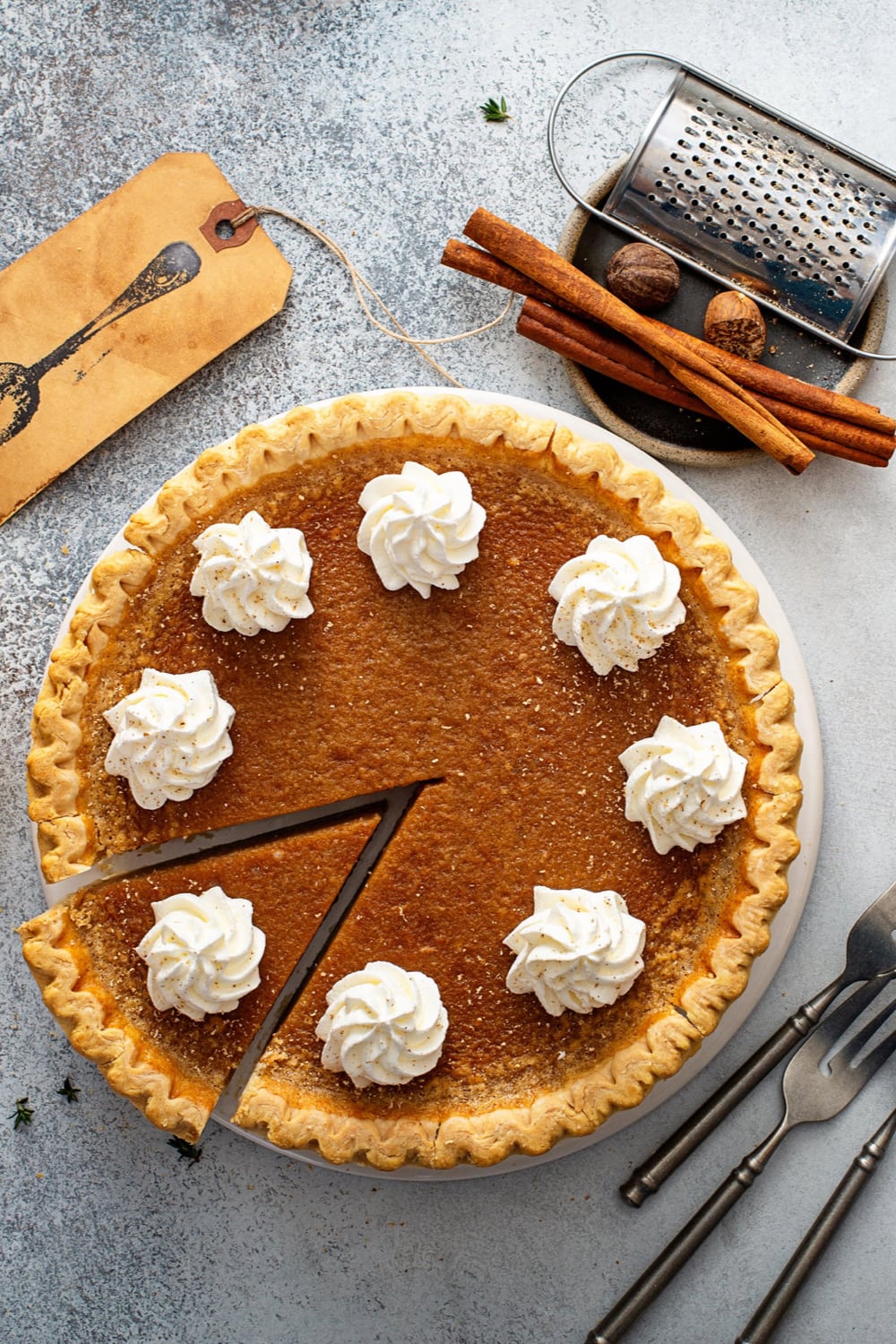 Top View Sweet Potato Pie with Whipped Cream and Cinnamon