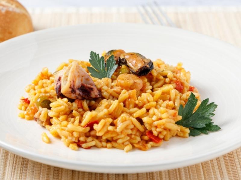 Paella on a White Plate Made From Valencia Rice
