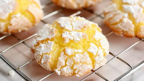 Close up of Lemon Crinkle Cookies on a Wire Rack