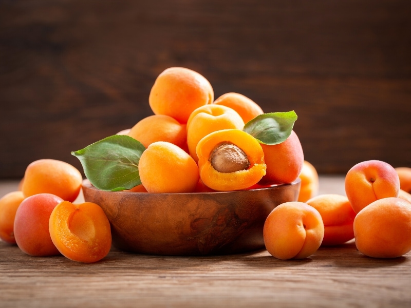 Fresh Apricot on Wooden Bowl