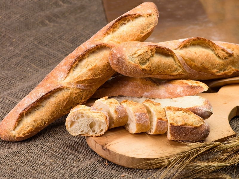  Baguette French Bread on a Wooden Cutting Board