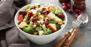 Bowl of Homemade Broccoli Salad with Beans, Apple and Nuts