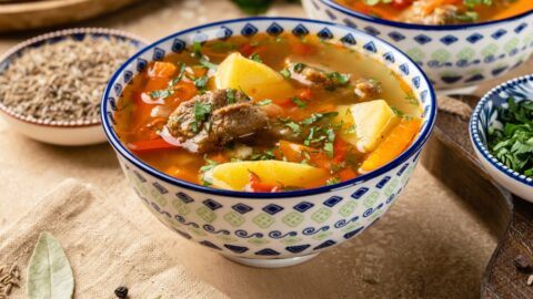 Bowl of Homemade Lamb Soup with Vegetables and Spices