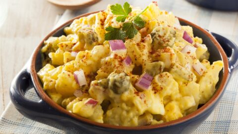 Bowl of Homemade Potato Salad with Onions and Eggs