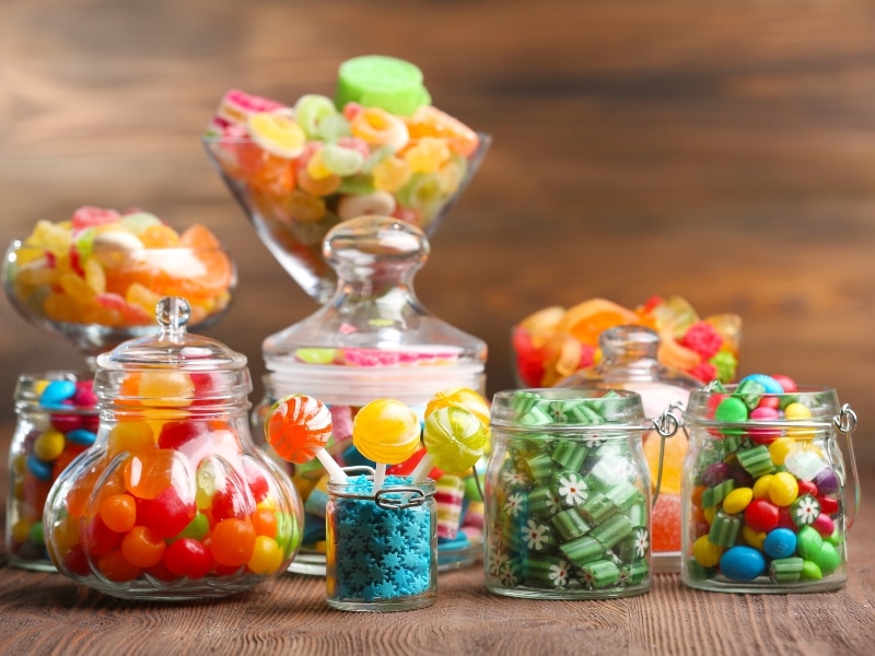 Different Types and Flavors of Candies on a Glass Jar