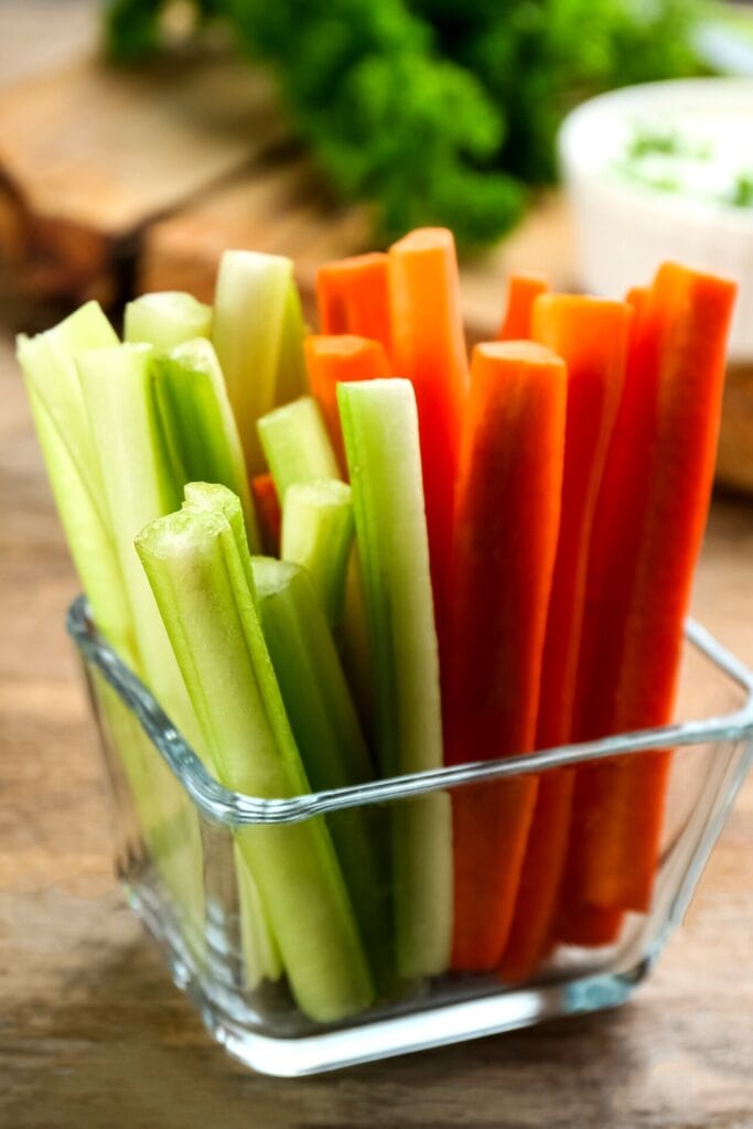 Celery and Carrot Sticks in a Glass Container