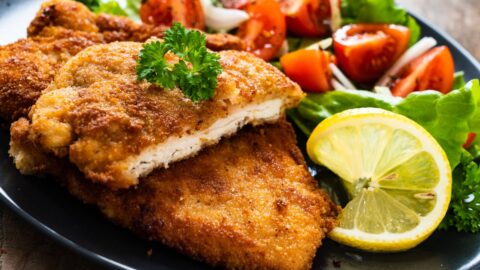Crispy Oven-Fried Breaded Pork Chop with Tomatoes and Lemon