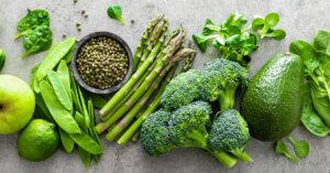 Fresh Fruits and Vegetables Including Asparagus, Broccoli, Peas, Avocado and Apple