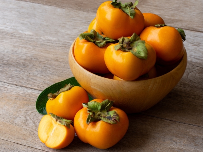 Fuyu Persimmons in a Wooden Bowl