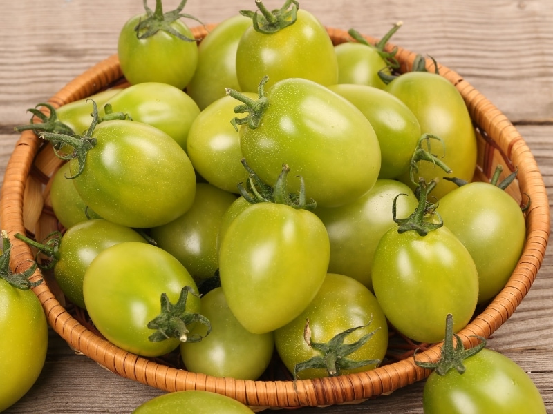 Green Tomato in a Bamboo Basket