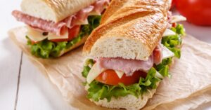 Healthy Homemade Baguette Sandwich with Ham, Cheese, Tomatoes and Lettuce