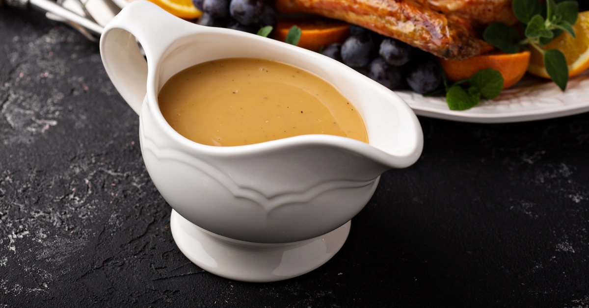 Homemade Brown Gravy in a White Container
