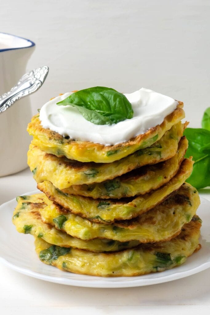 Homemade Green Zucchini Fritters with Sour Cream