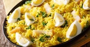 Homemade Kedgeree with Rice, Egg and Smoked Haddock in a Black Plate