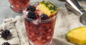 Homemade Refreshing Sherry Cobbler Cocktail with Blackberry and Pineapple