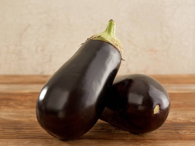 Fresh Italian Eggplant on Wooden Table