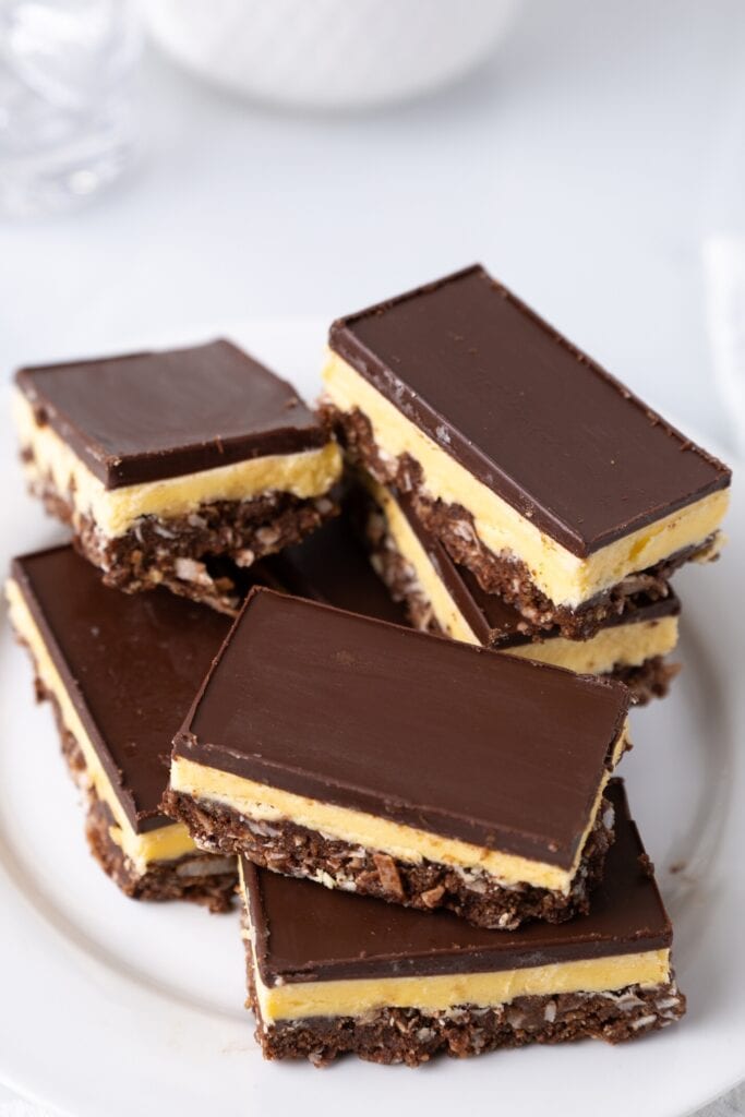 Pile of Nanaimo Bars Served on a White Plate
