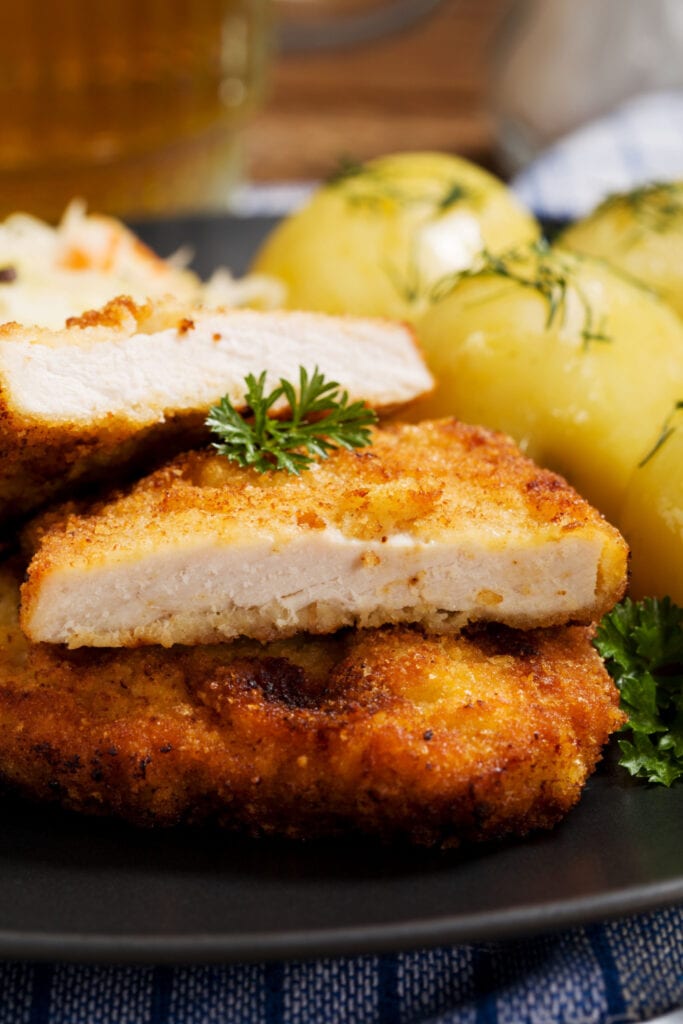 Oven-Fried Pork Chops Served With Boiled Potatoes
