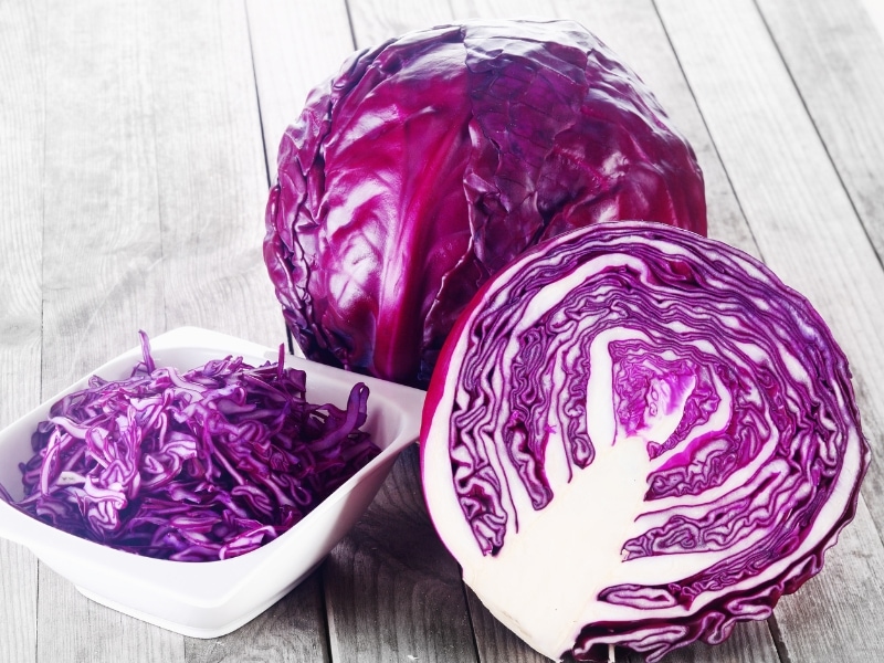 Whole and Sliced Purple Cabbage