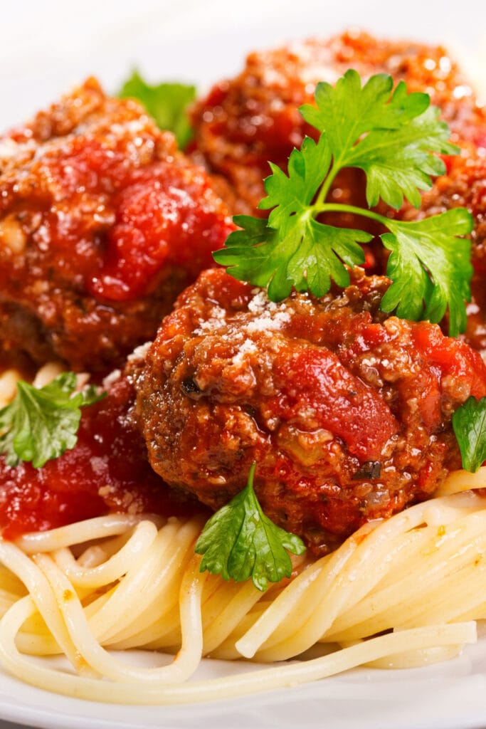 Rachael Ray's meatballs over spaghetti with fresh parmesan and parsley 