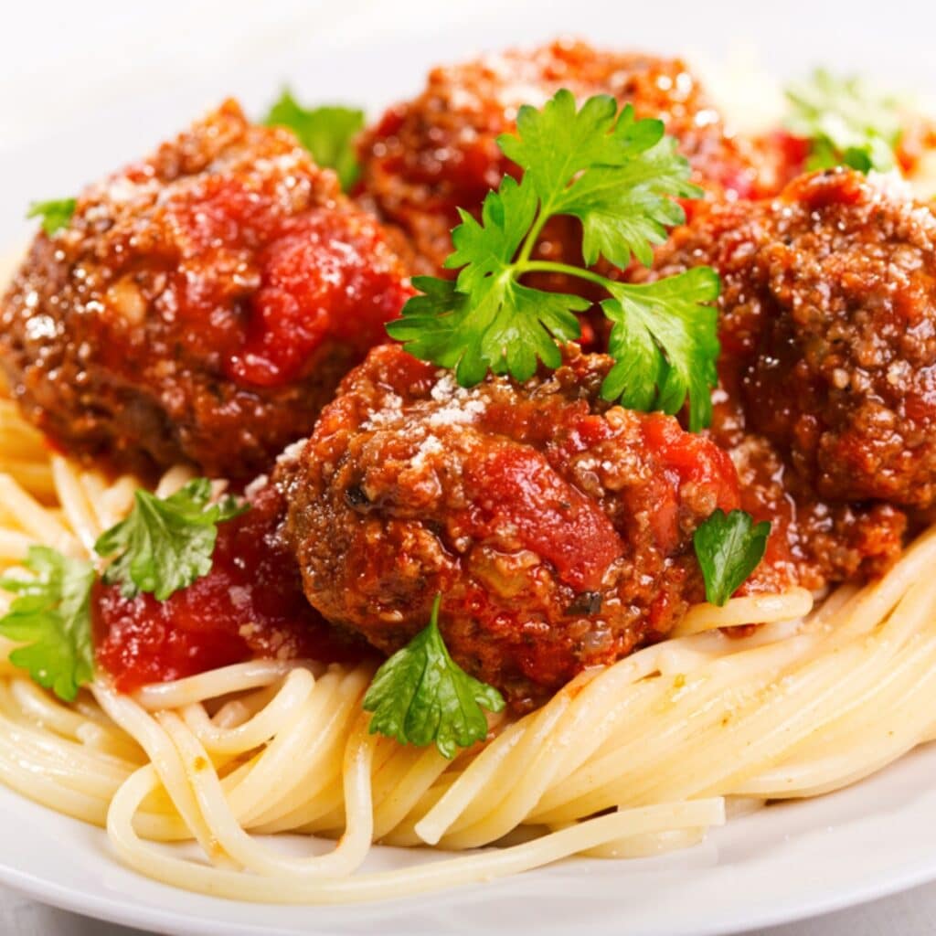 Rachael Ray's meatballs over spaghetti with fresh parmesan and parsley 