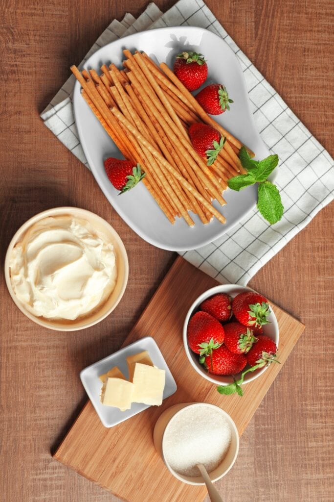 Strawberry Pretzel Salad Ingredients: Strawberries, Pretzels, Cream Cheese, Cool Whip, Butter, Gelatin, 