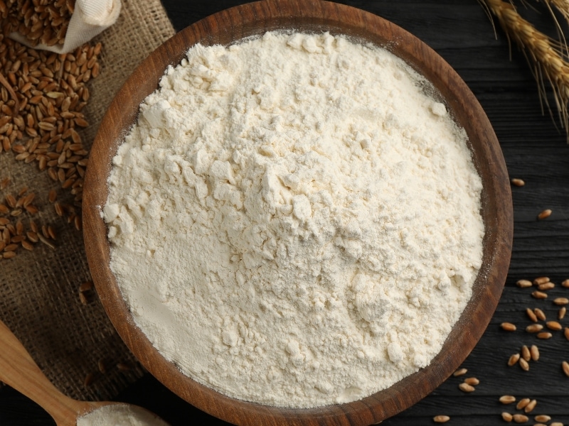 Vital Wheat Gluten Flour in a Wooden Bowl and Table