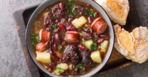 Warm Homemade Portuguese Stone Soup with Sausage, Potatoes, Beans and Bread