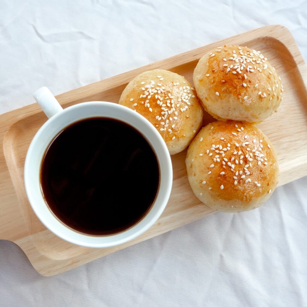White Buns with Sesame Seeds Served with Coffee