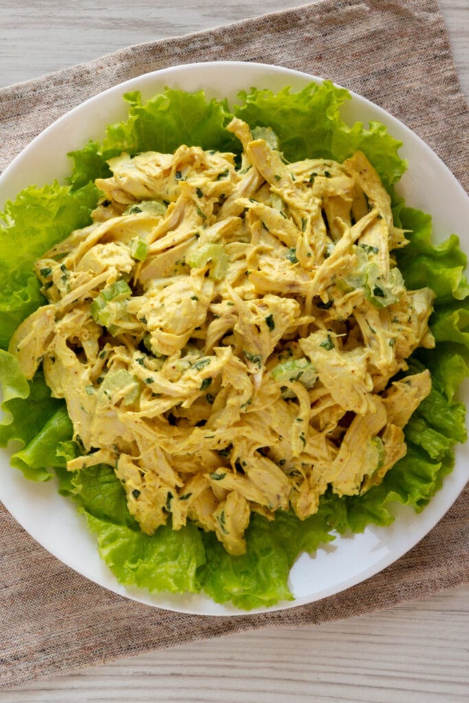 A plate of Coronation Chicken and Lettuce on White Plate