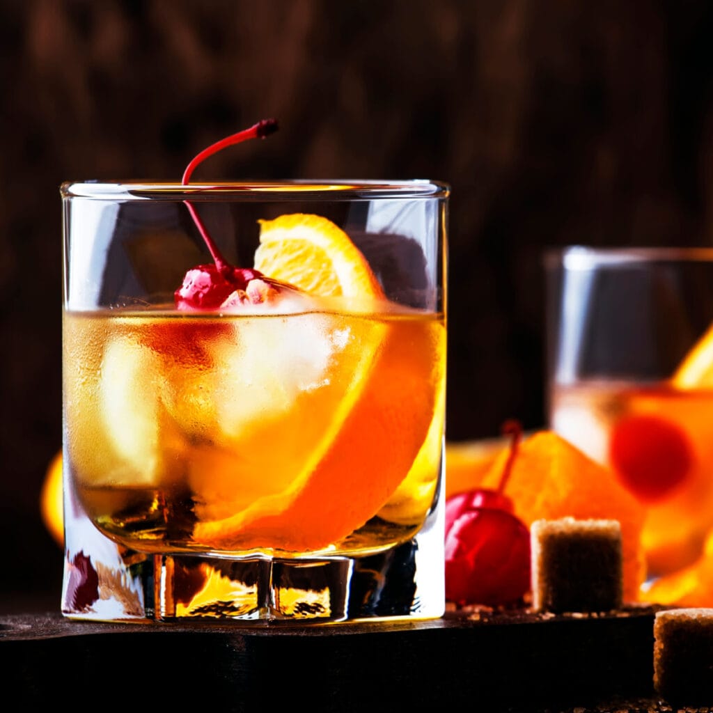 Bitter Cocktail With Orange Slices and Fresh Cherries
