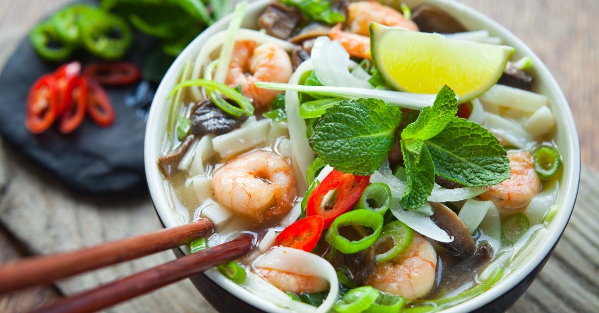 Bowl of Vietnamese Pho Soup with Prawns and Vegetables