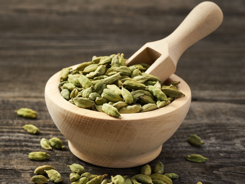 Cardamom in Wooden Bowl with Scooper