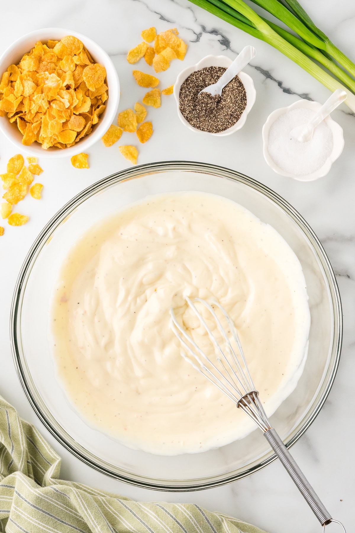 Condensed soup and sour cream in a glass bowl