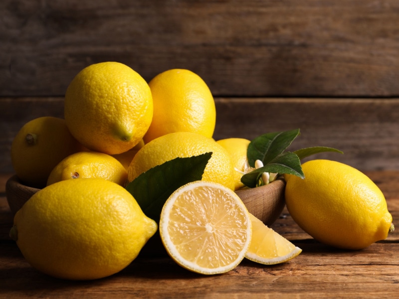Citron Lemons in a Wooden Bowl and Table