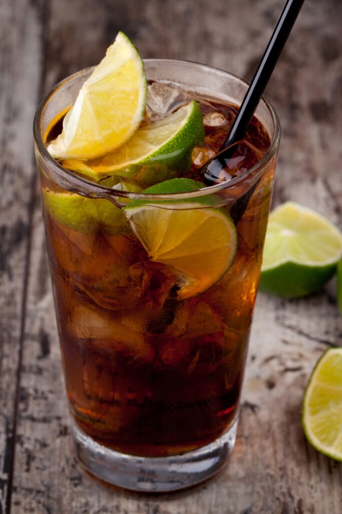 Cuba Libre with Lime on a Wooden Table