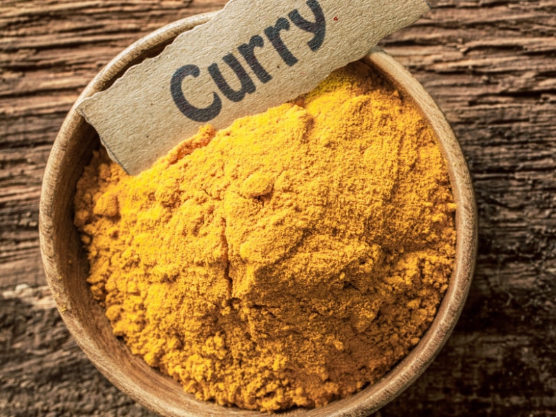 Curry Powder in a Wooden Bowl with Label
