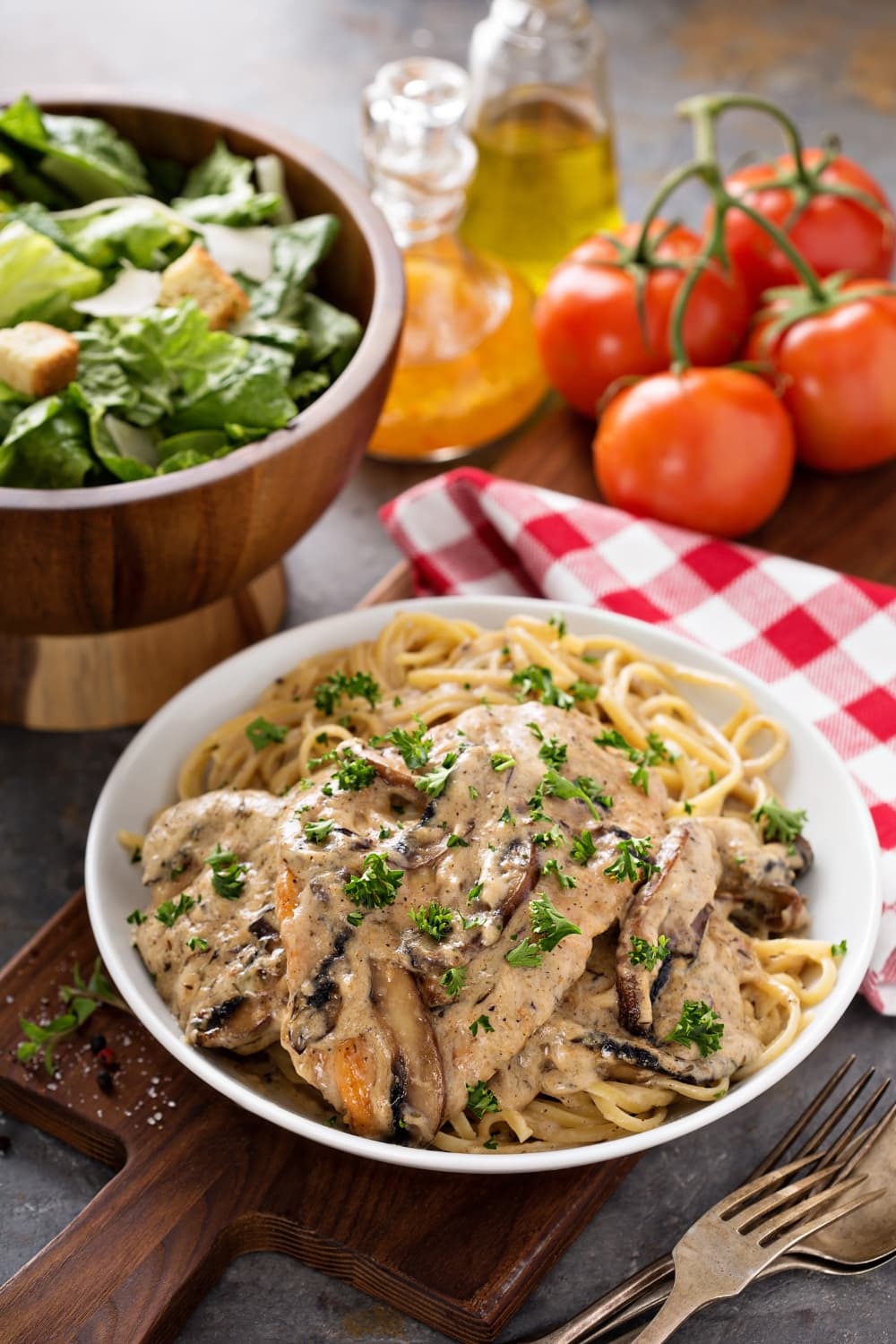 Delicious Homemade Chicken Marsala with Pasta and Mushrooms Served with Green Salad