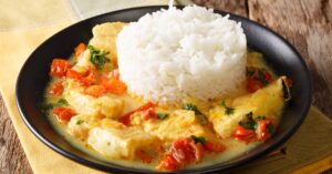 Ecuadorian Food: Fish and Rice with Coconut Sauce and Tomatoes