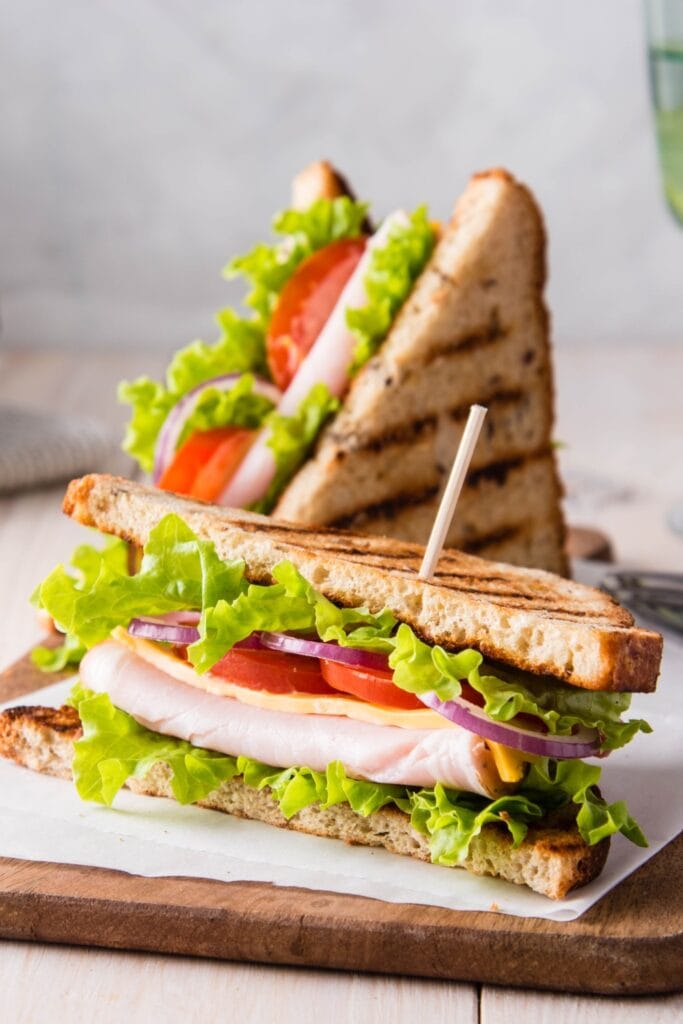 Ham and Cheese Sandwich with Tomatoes and Green Salad