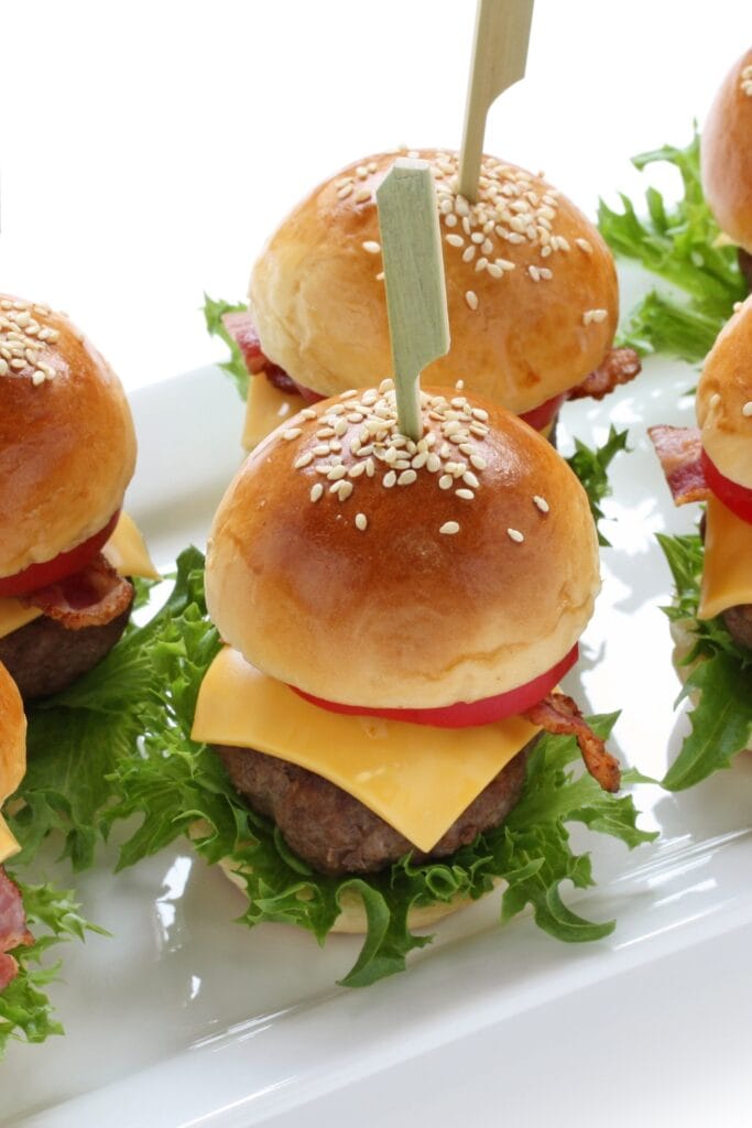 Hamburger Sliders with Cheese, Onions and Sesame Seeds