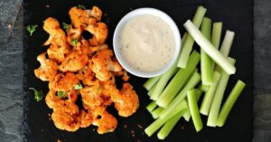 Homemade Buffalo Cauliflower Wings with Celery and Dipping Sauce