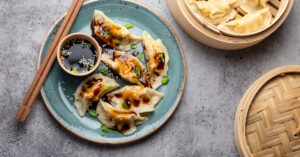 Homemade Chinese Dumplings with Soy Sauce in a Plate
