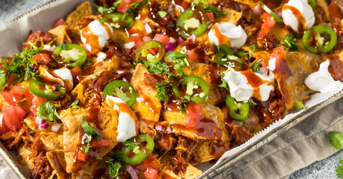 Homemade Pulled Pork Nachos with Tomatoes and Cream Cheese