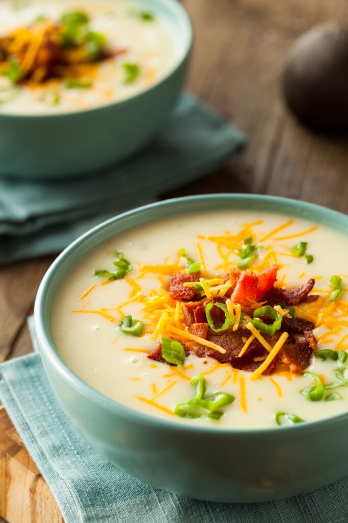 Homemade Potato Soup with Bacon, Cheese and Onions in a Bowl