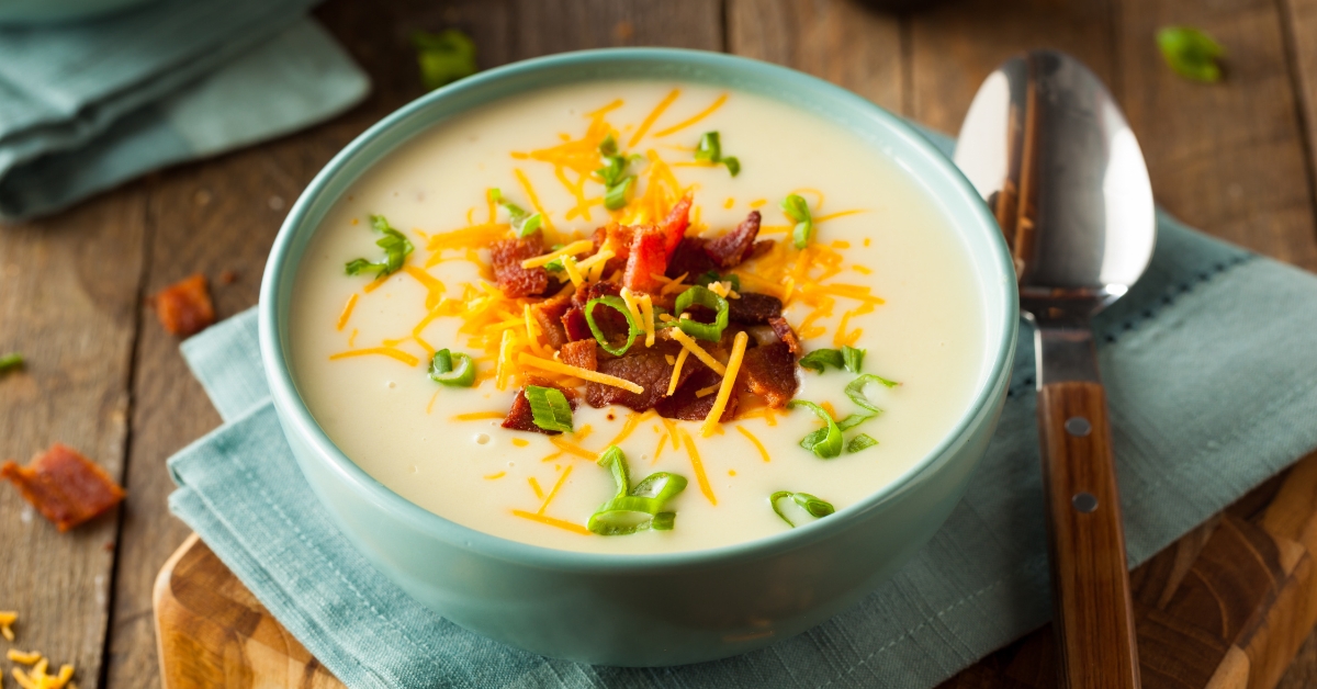 Homemade Warm Sweet Potato Soup with Bacon and Cheese in a Bowl
