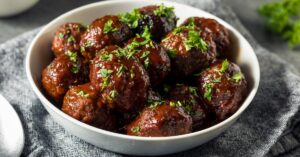 Homemade Meatballs with BBQ Sauce in a White Plate