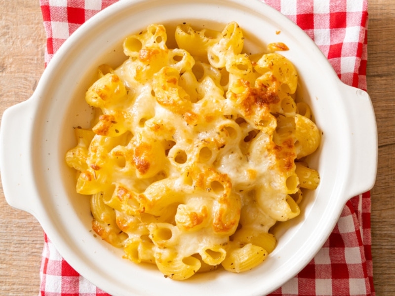 Macaroni and Cheese in a Baking Bowl with Cheesy Sauce
