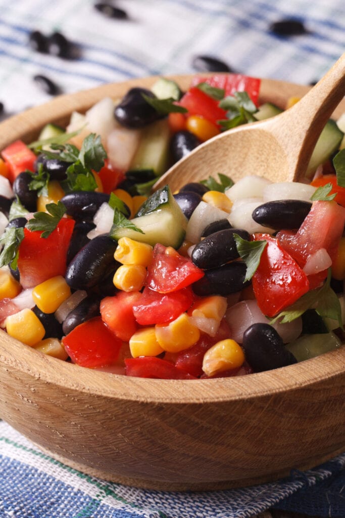 Mexican bean salad with black beans, kidney beans, cannellini beans, bell pepper, and corn.