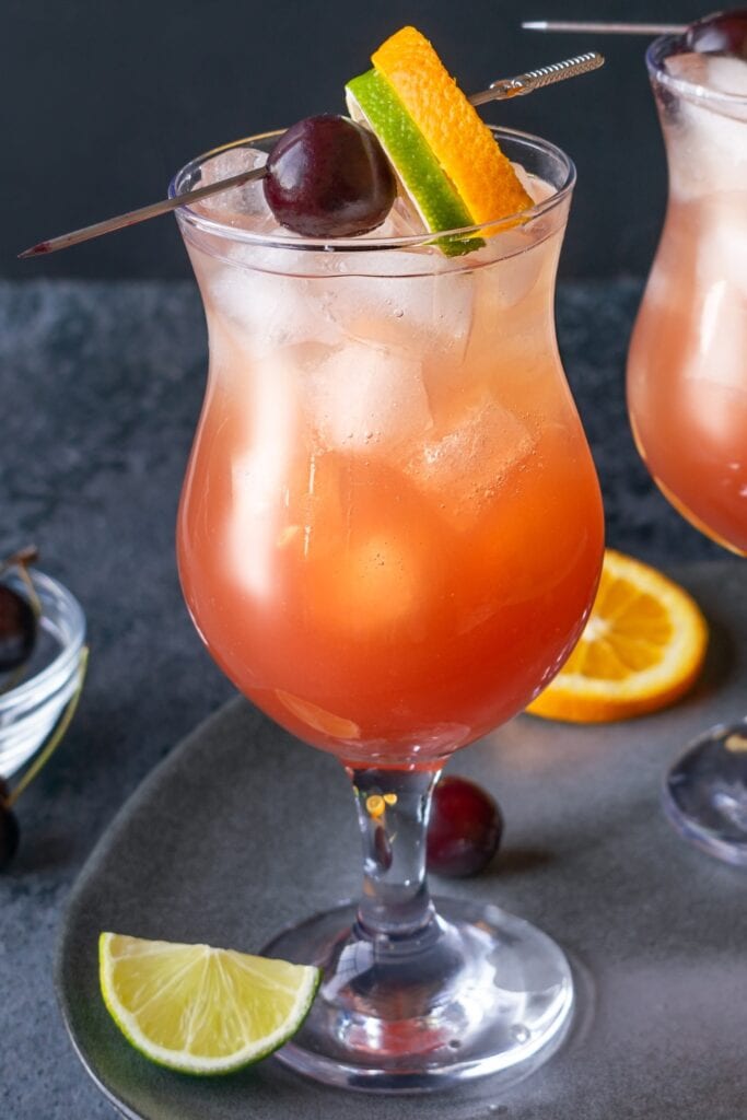 New Orleans Cocktail with Orange, Lime and Cherry